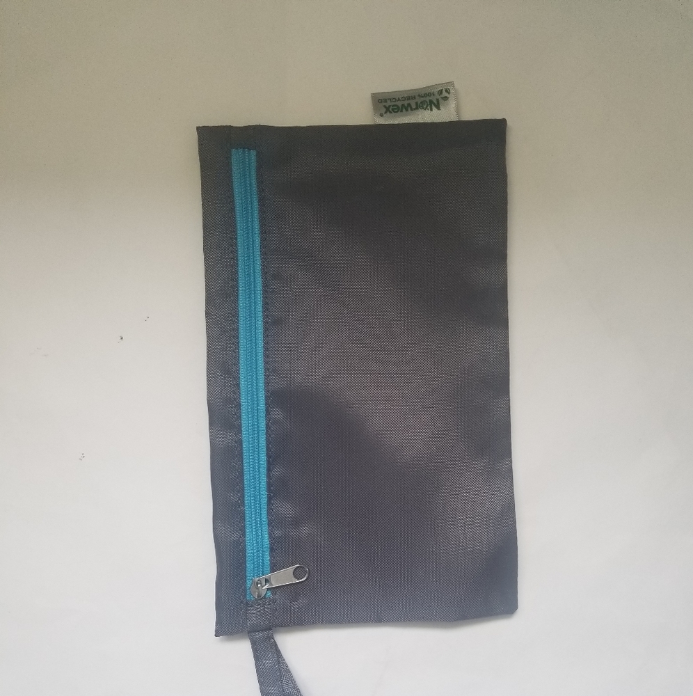 Gray wristlet to carry face masks by Norwex